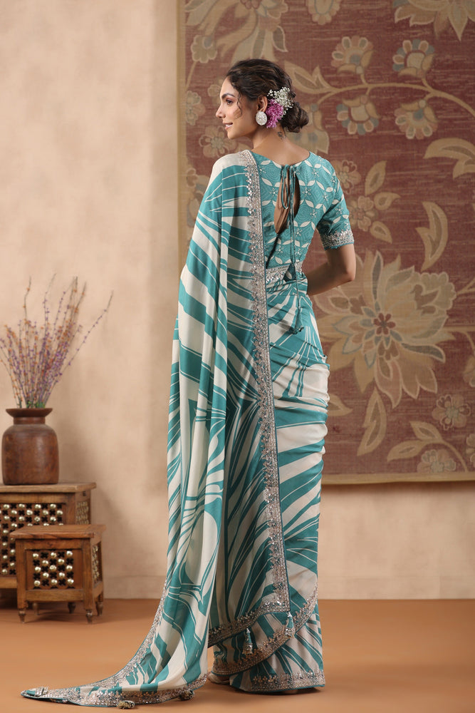 Mesmerizing Beige and Blue Muslin Saree with Geometrical Prints and Handcrafted Gota and Cutdana Work