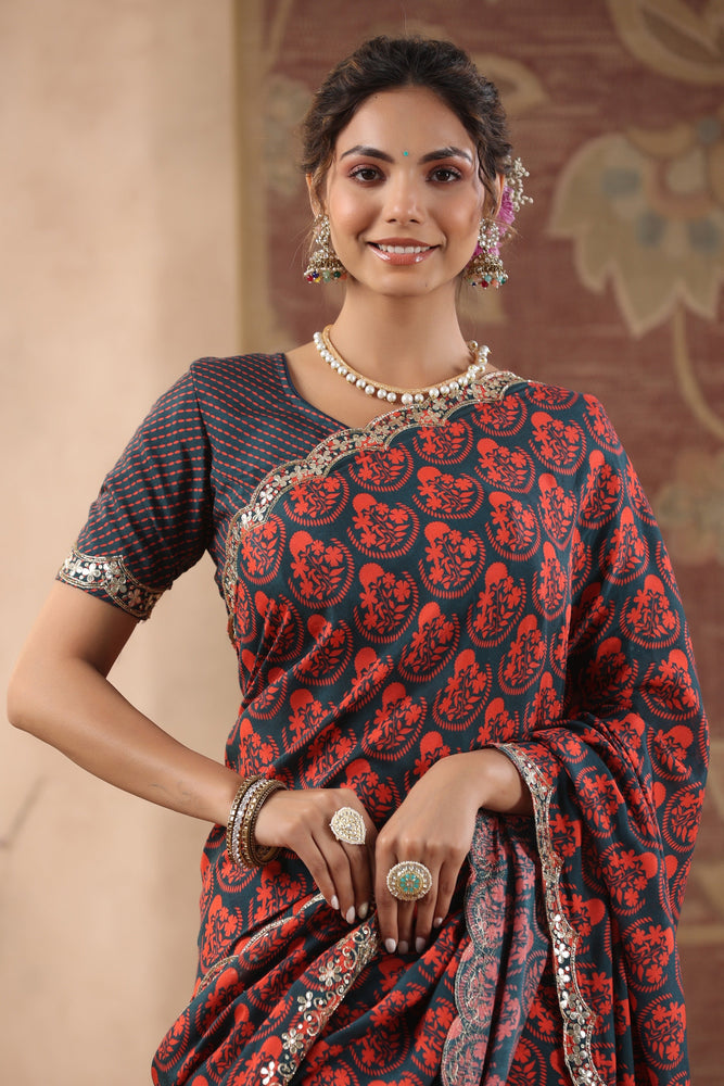 Experience Beauty in Contrast with Blue and Red Muslin Saree.