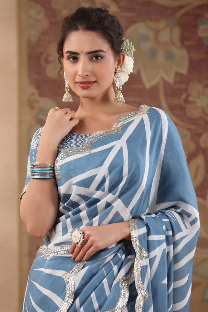 Elevate Your Style with Cream and Blue Muslin Saree.