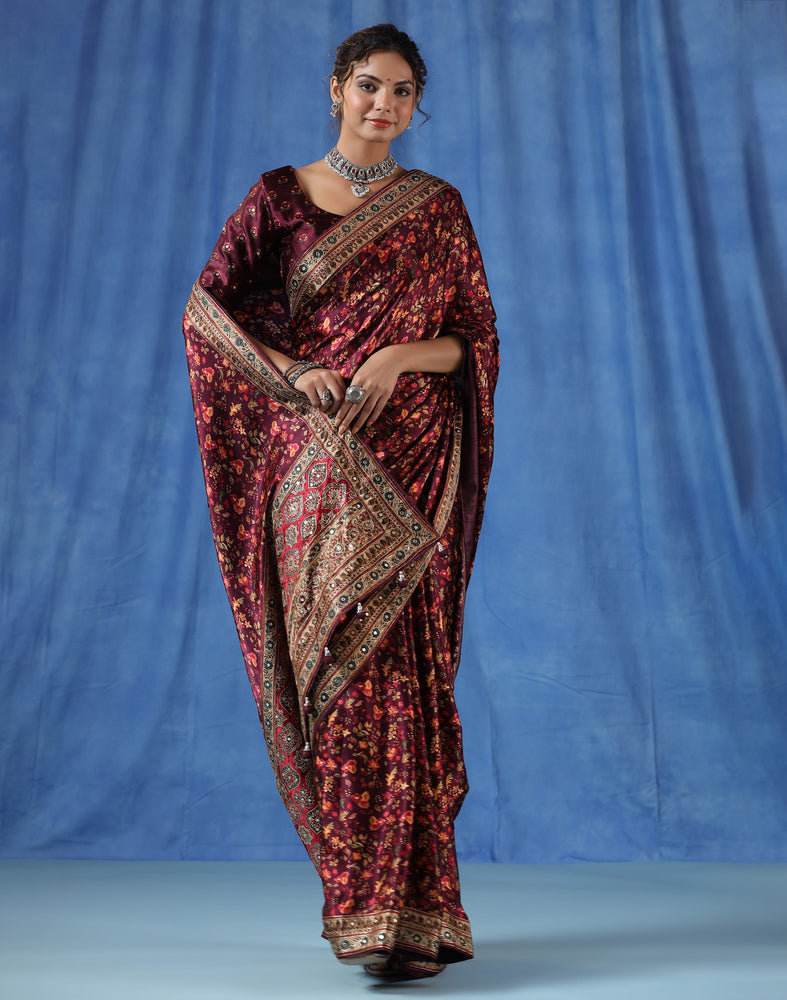 Maroon Satin Crepe Saree with Traditional Flower Prints and Handcrafted Aari Work Border